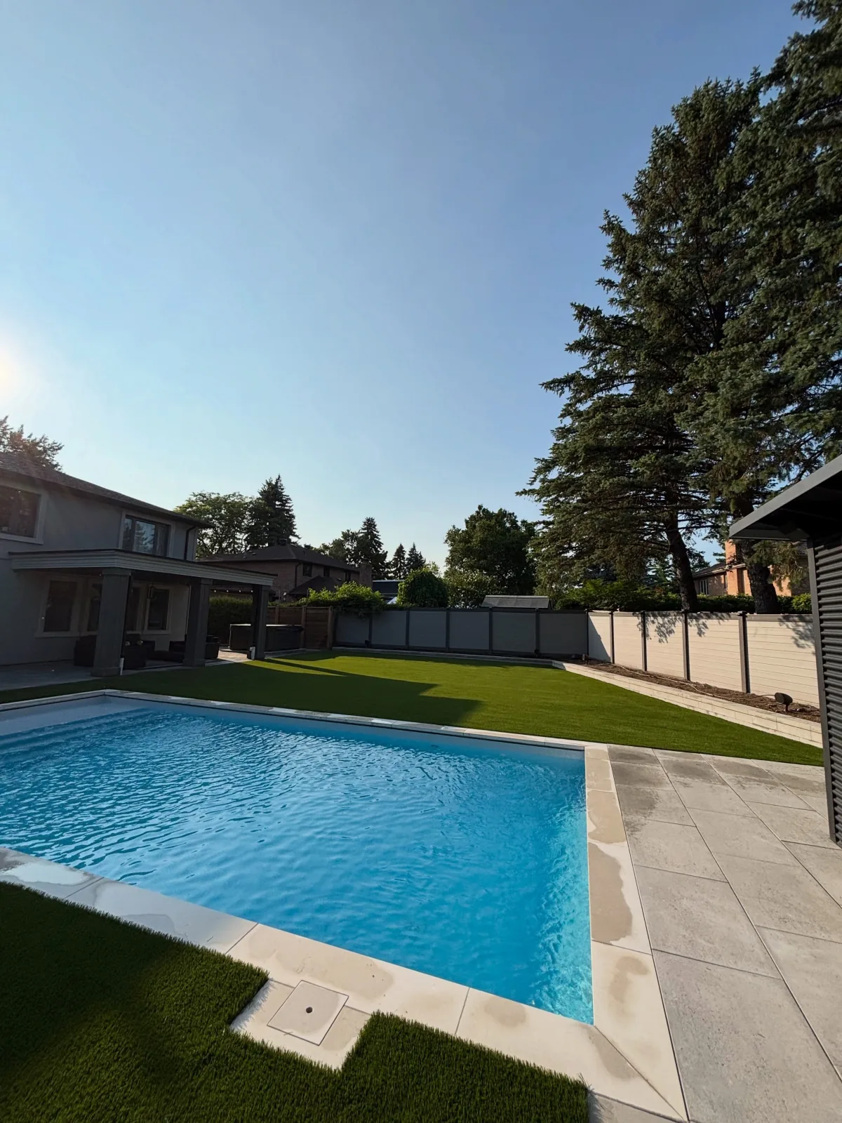 Poolside artificial turf installation in Vaughan